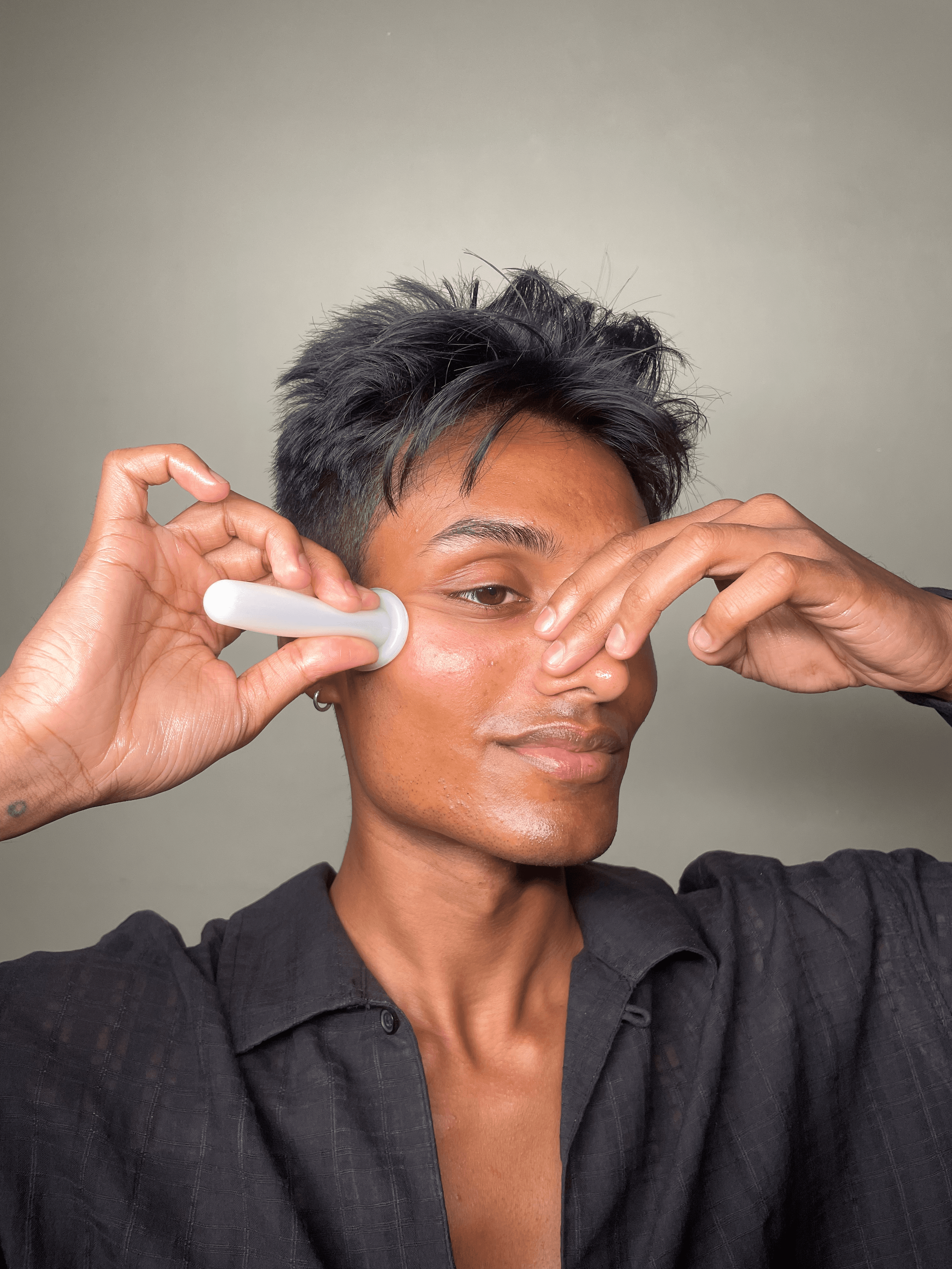 Facial Gua Sha: smoothing the cheek with acupressure point activation