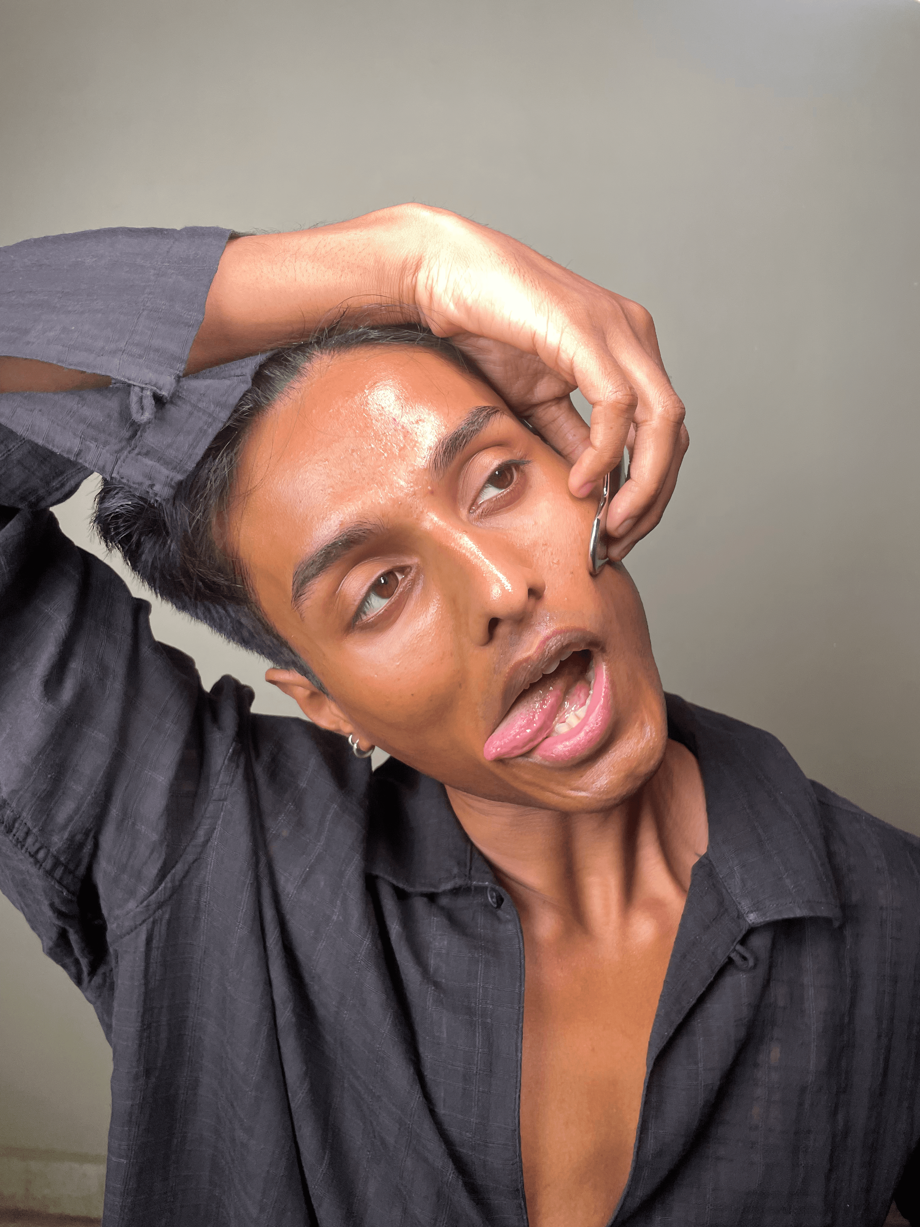 Cheek activation: pinching technique to stimulate facial muscles